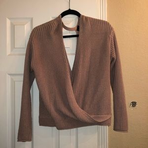 woman’s blush pink sweater